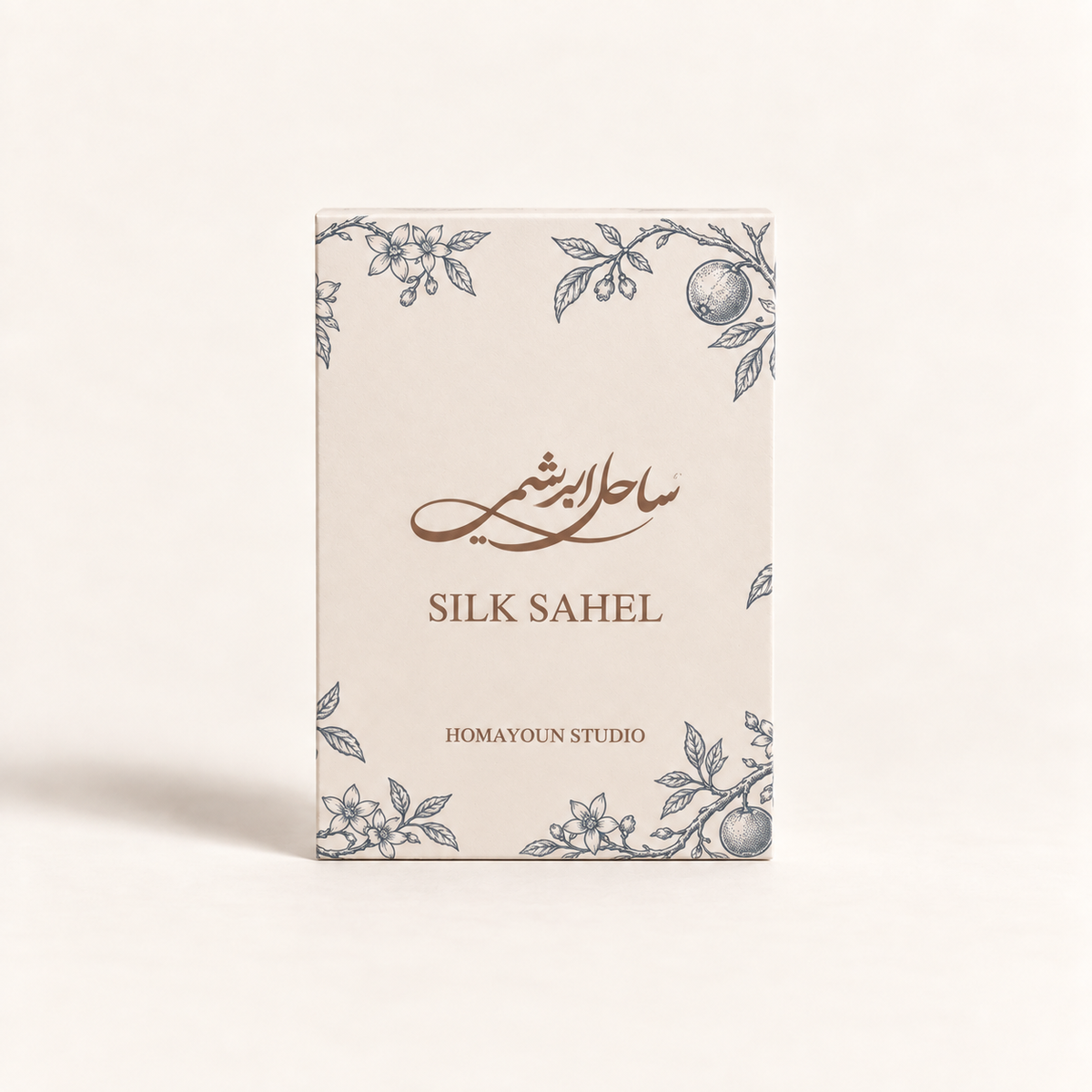 A rectangular product box for Silk Sahel by Homayoun Studio, featuring a cream-colored background with delicate blue-gray botanical illustrations and brown text.